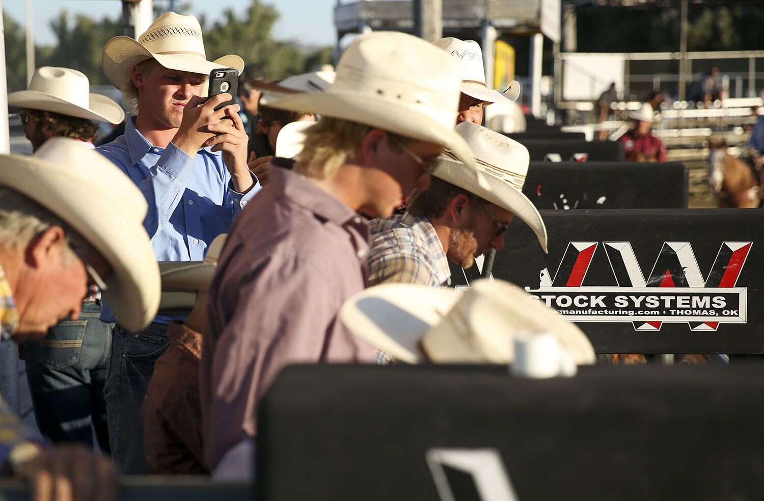 Gus Harvey sets the camera up to record another saddle bronc rider